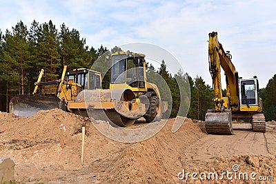 Excavator and Dozer and Vibro Roller Soil Compactor at road construction and bridge projects in forest area. Heavy machinery for Stock Photo