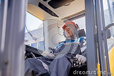 Excavator driver portrait, industrial senior male worker Stock Photo