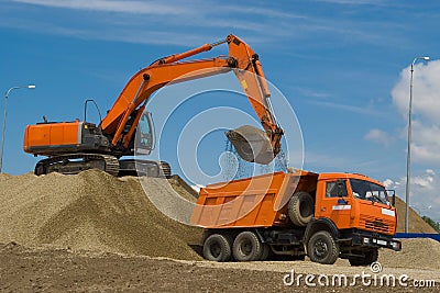 Excavator and dump truck Stock Photo