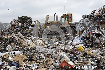 Excavator At Dumping Ground Stock Photo