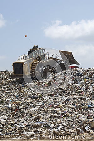 Excavator At Dumping Ground Stock Photo