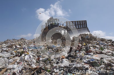 An Excavator At Dumping Ground Stock Photo