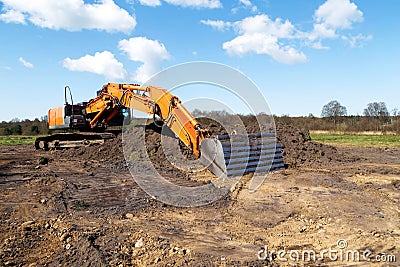 Excavator helps cultivate a nature reserve Stock Photo