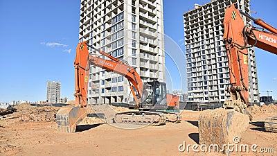 Excavator HITACHI ZAXIS 200 working at construction site. Construction machinery for excavating, Editorial Stock Photo