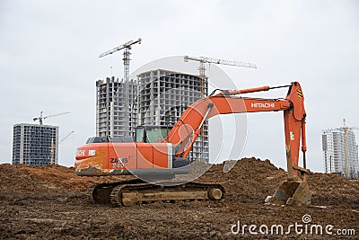 Excavator HITACHI ZAXIS 240 working at construction site Editorial Stock Photo