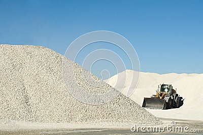 Excavator in a limestone quarry Stock Photo