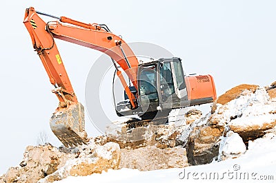 Excavator loader at winter works Stock Photo