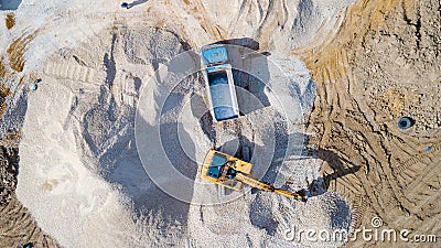 Excavator loads sand Editorial Stock Photo