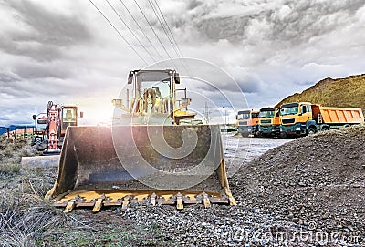 Excavator moving stone and rock at a construction site Stock Photo