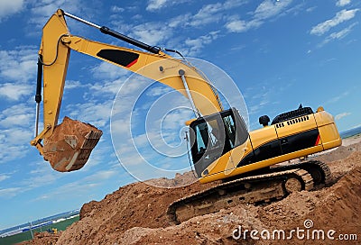 Excavator in sandpit Stock Photo