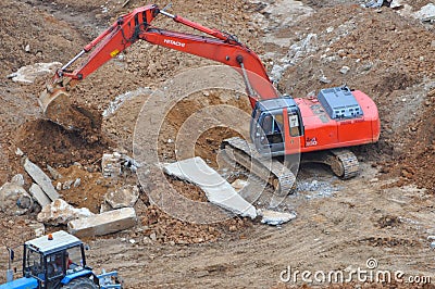 Excavator working on the site Editorial Stock Photo