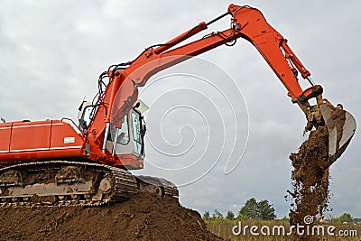 The excavator works at soil movement Stock Photo