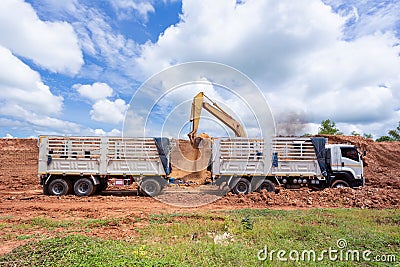 Excavator,Yellow Makro Loader Truck bunch transport,motion blur,overuse of noise reduction Stock Photo