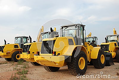 Excavators in stock yard Stock Photo