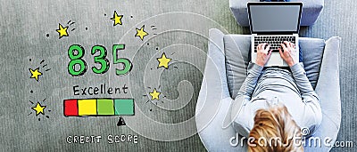 Excellent credit score theme with man using a laptop Stock Photo