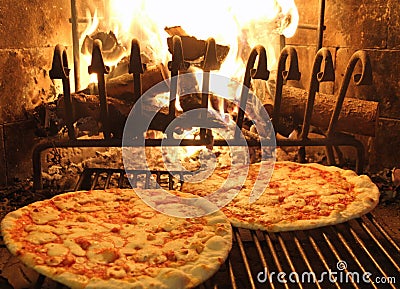 Excellent fragrant pizza baked in a wood fireplace 1 Stock Photo