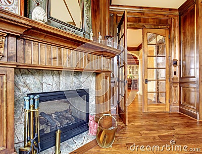 Excellent stone fireplace in hardwood room. Stock Photo