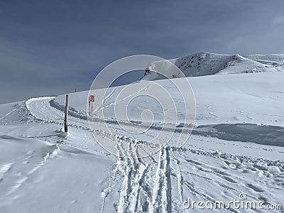 Excellently arranged and cleaned winter trails for walking, hiking, sports and recreation in the area of the resort of Arosa Stock Photo