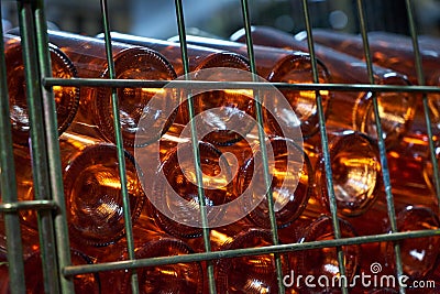 Excerpt wine in glass bottles under special lighting. Stock Photo