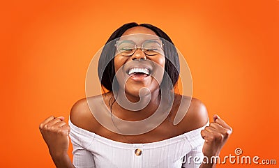 Excited African American Lady Gesturing Yes Standing Over Orange Background Stock Photo