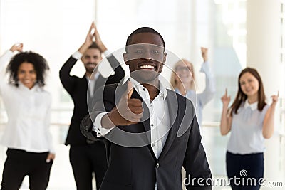 Excited African American leader, employee or manager show thumbs up Stock Photo