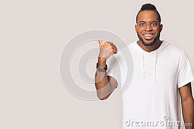 Excited african American man point at blank copy space Stock Photo