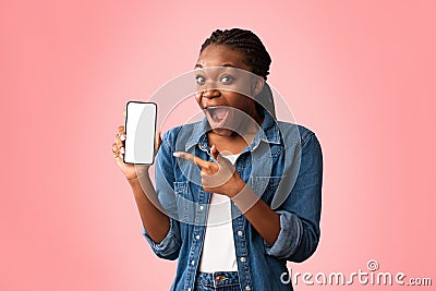 Excited African Lady Showing Phone Blank Screen Over Pink Background Stock Photo