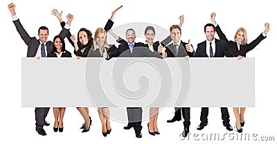 Excited business people presenting empty banner Stock Photo