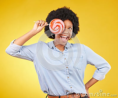Excited, candy and lollipop with black woman in studio for colorful, cheerful and positive. Young, happiness and dessert Stock Photo