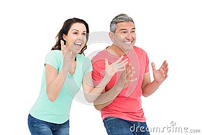 Excited couple cheering Stock Photo