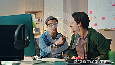 Excited creators talking video call computer office closeup. Coworkers laughing Stock Photo