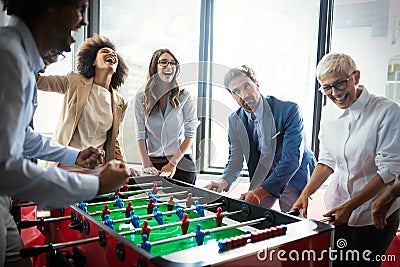 Excited diverse employees enjoying funny activity at work break, creative friendly workers play game Stock Photo