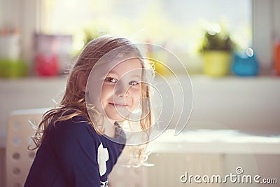 Excited face of pretty small girl at sunny day Stock Photo