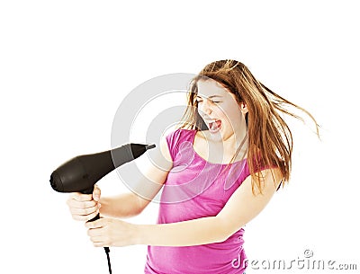 Excited female drying her hairs with drier Stock Photo