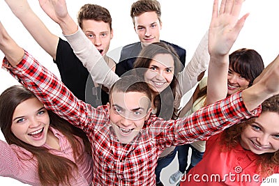 Excited group of people with arms up Stock Photo