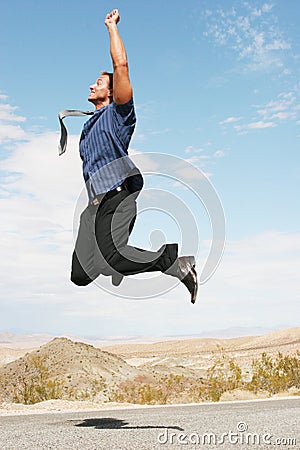 Excited happy businessman jumping in the air Stock Photo