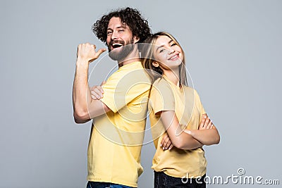 Excited young couple winners celebrate win motivated by triumph rejoice, victory success together isolated on grey background Stock Photo