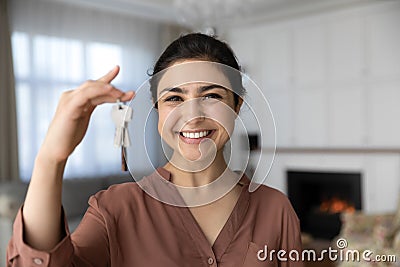 Excited indian female become homeowner look at camera hold key Stock Photo