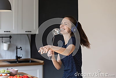 Excited joyful young girl enjoying domestic entertainment Stock Photo