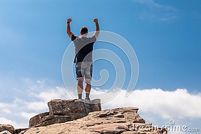 Excited Man On Top In A Beautiful Summer Landscape Stock Photo