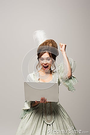 excited retro style woman showing triumph Stock Photo
