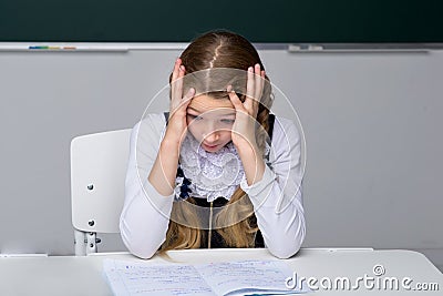 Excited schoolgirl looking at her notebook Stock Photo