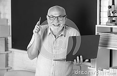 Excited senior teacher lecturer greeting students at workshop. Amazed surprised face of funny professor. Elderly Stock Photo