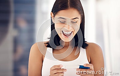 Excited, smile and woman with positive pregnancy test results with happy expression on face in bathroom. Family, love Stock Photo