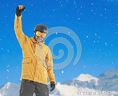 Excited snowboarder in the mountains Stock Photo