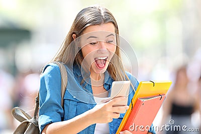 Excited student receiving good online news Stock Photo