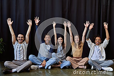 excited stylish multiethnic team sitting and Stock Photo