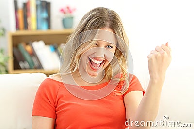 Excited successful woman looking at camera Stock Photo