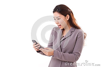 Excited, surprised business woman looking at her mobile phone Stock Photo