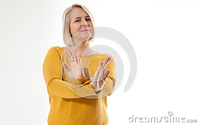 Excited woman showing the sign of stop, neglect, negation and reluctance Stock Photo